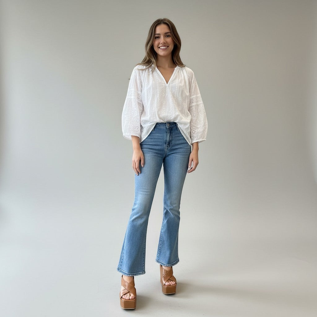 Jolie Jordan Boutique model wearing Vicini cognac leather crossover strap wedge mules with open square toe and platform sole.